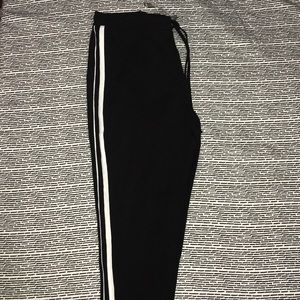 Black sweatpants with stripes on the sides